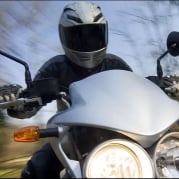 Biker on twin headlight motorcycle